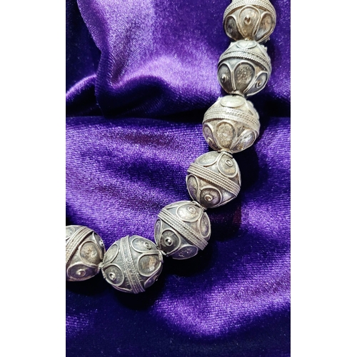 227 - A UNIQUE & BEAUTIFUL AFGHAN SILVER BEAD NECKLACE, each bead hand crafted, 45cm long open. Each bead ... 