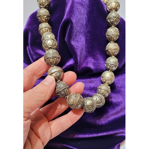 227 - A UNIQUE & BEAUTIFUL AFGHAN SILVER BEAD NECKLACE, each bead hand crafted, 45cm long open. Each bead ... 