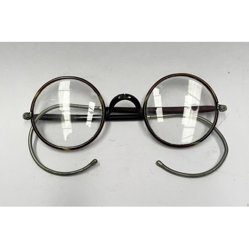 238 - A VINTAGE PAIR OF CASED GLASSES, folding glasses with round frames, the frames having two tones and ... 