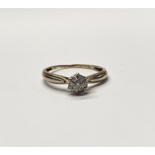 241 - A LOVELY 9CT YELLOW GOLD DIAMOND CLUSTER RING, with central round cut diamond in star setting surrou... 