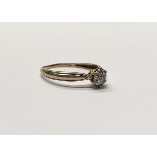 241 - A LOVELY 9CT YELLOW GOLD DIAMOND CLUSTER RING, with central round cut diamond in star setting surrou... 