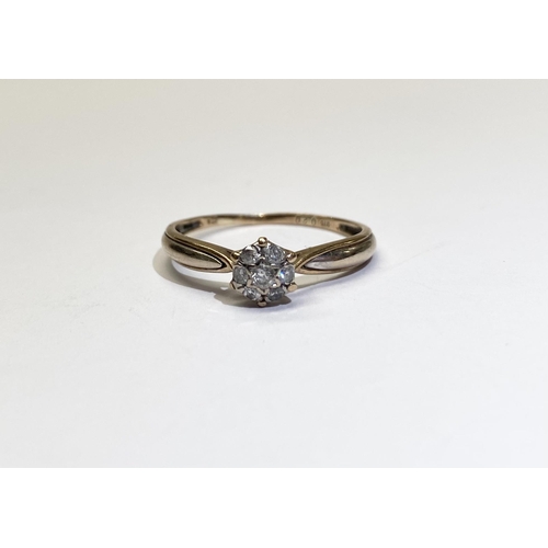 241 - A LOVELY 9CT YELLOW GOLD DIAMOND CLUSTER RING, with central round cut diamond in star setting surrou... 