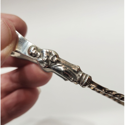 25 - A LATE 19TH CENTURY SILVER MONK SUGAR TONGS, each stem with a monk figure above a barley twist detai... 