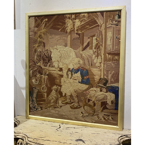 253 - A CHARMING VINTAGE FRAMED WOOLWORK TAPESTRY, depicting a rural scene with mother, child, horses, a d... 