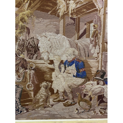 253 - A CHARMING VINTAGE FRAMED WOOLWORK TAPESTRY, depicting a rural scene with mother, child, horses, a d... 