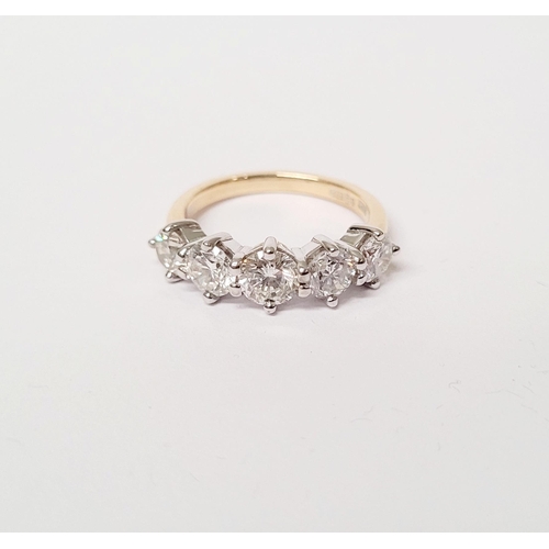 37 - A SPECTACULAR 18CT GOLD FIVE STONE GRADUATED DIAMOND RING, with a central diamond of .6cts, flanked ... 