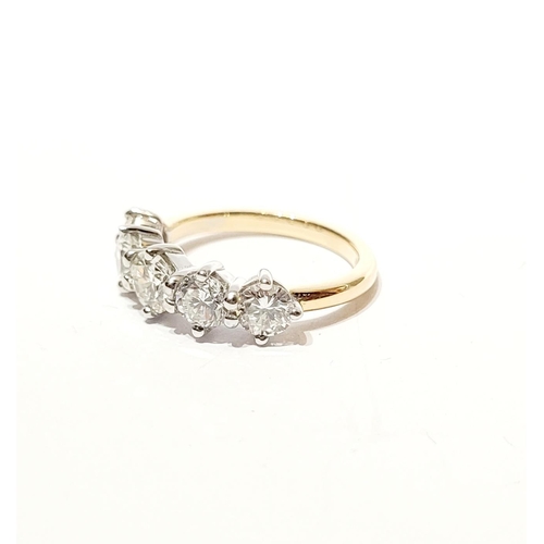 37 - A SPECTACULAR 18CT GOLD FIVE STONE GRADUATED DIAMOND RING, with a central diamond of .6cts, flanked ... 