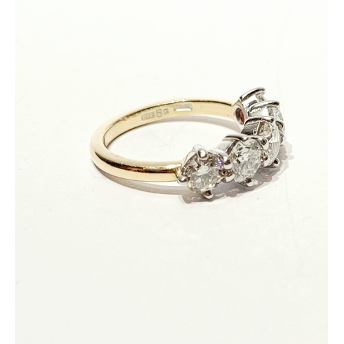 37 - A SPECTACULAR 18CT GOLD FIVE STONE GRADUATED DIAMOND RING, with a central diamond of .6cts, flanked ... 