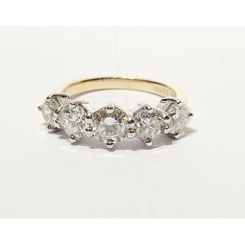 37 - A SPECTACULAR 18CT GOLD FIVE STONE GRADUATED DIAMOND RING, with a central diamond of .6cts, flanked ... 