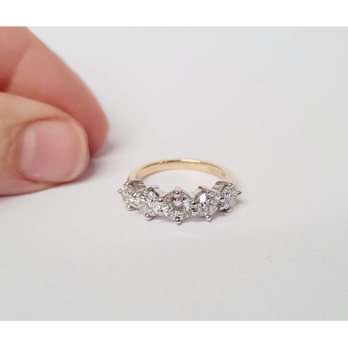 37 - A SPECTACULAR 18CT GOLD FIVE STONE GRADUATED DIAMOND RING, with a central diamond of .6cts, flanked ... 