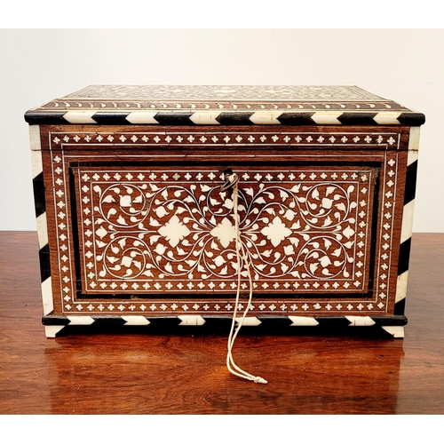 38 - A BEAUTIFULLY CRAFTED INLAID TEA CADDY, decorated all over with inlaid design, the hinged lid openin... 