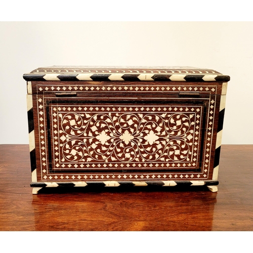 38 - A BEAUTIFULLY CRAFTED INLAID TEA CADDY, decorated all over with inlaid design, the hinged lid openin... 