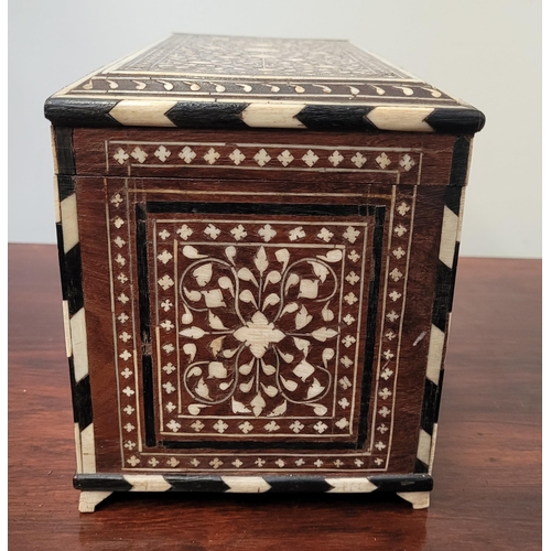 38 - A BEAUTIFULLY CRAFTED INLAID TEA CADDY, decorated all over with inlaid design, the hinged lid openin... 