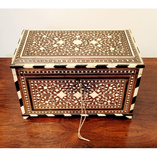 38 - A BEAUTIFULLY CRAFTED INLAID TEA CADDY, decorated all over with inlaid design, the hinged lid openin... 