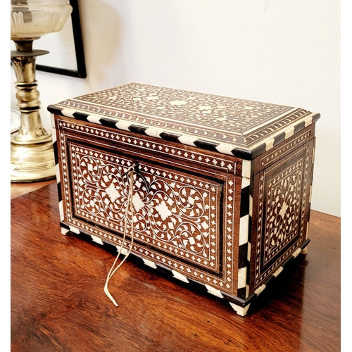 38 - A BEAUTIFULLY CRAFTED INLAID TEA CADDY, decorated all over with inlaid design, the hinged lid openin... 