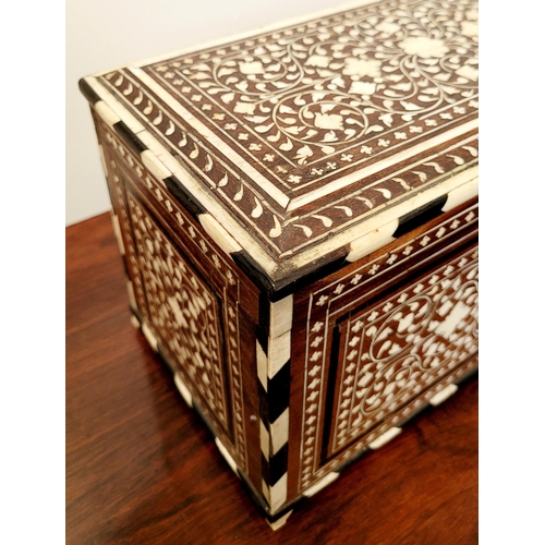 38 - A BEAUTIFULLY CRAFTED INLAID TEA CADDY, decorated all over with inlaid design, the hinged lid openin... 