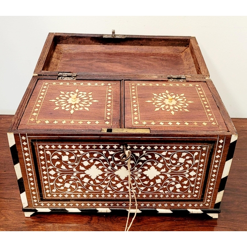 38 - A BEAUTIFULLY CRAFTED INLAID TEA CADDY, decorated all over with inlaid design, the hinged lid openin... 