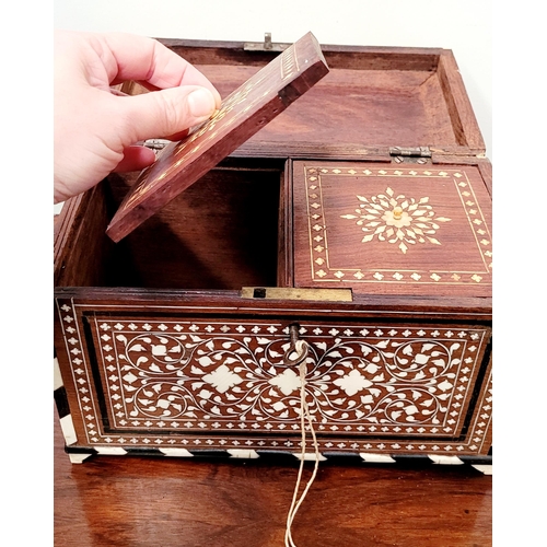 38 - A BEAUTIFULLY CRAFTED INLAID TEA CADDY, decorated all over with inlaid design, the hinged lid openin... 