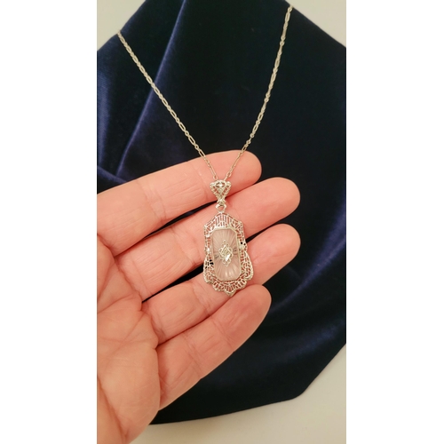 4 - A DELICATE EDWARDIAN STYLE 14CT WHITE GOLD DIAMOND CAMPHOR GLASS PENDANT NECKLACE, the rectangular s... 