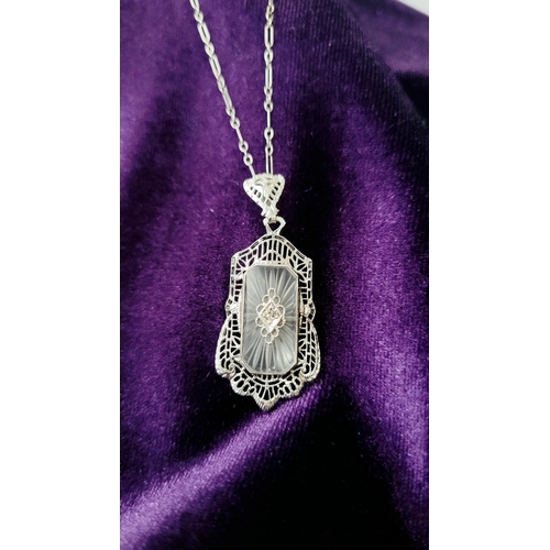 4 - A DELICATE EDWARDIAN STYLE 14CT WHITE GOLD DIAMOND CAMPHOR GLASS PENDANT NECKLACE, the rectangular s... 