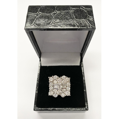 5 - A FANTASTIC 18CT WHITE GOLD ART DECO STYLE DIAMOND CLUSTER RING, with three central baguette cut dia... 