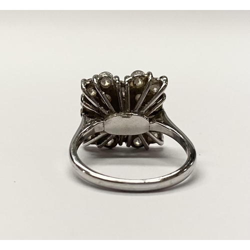 5 - A FANTASTIC 18CT WHITE GOLD ART DECO STYLE DIAMOND CLUSTER RING, with three central baguette cut dia... 