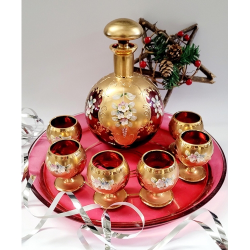 52 - A VINTAGE BOHEMIAN ENAMEL DECORATED DECANTER & GLASS SET, each piece finished with bright gold detai... 