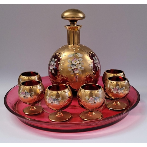 52 - A VINTAGE BOHEMIAN ENAMEL DECORATED DECANTER & GLASS SET, each piece finished with bright gold detai... 