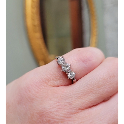 57 - A VINTAGE YELLOW GOLD THREE STONE DIAMOND RING, a pretty setting, perfect for any occasion. Ring siz... 