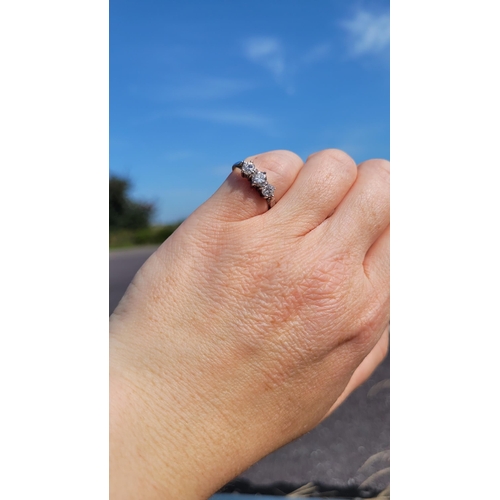 57 - A VINTAGE YELLOW GOLD THREE STONE DIAMOND RING, a pretty setting, perfect for any occasion. Ring siz... 