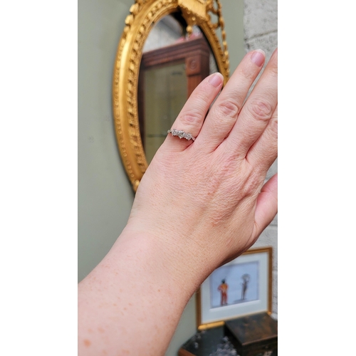 57 - A VINTAGE YELLOW GOLD THREE STONE DIAMOND RING, a pretty setting, perfect for any occasion. Ring siz... 