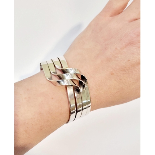 58 - A VERY FINE & WONDERFULLY CRAFTED MID-CENTURY STERLING SILVER WAVE BRACELET BANGLE, comprising of fo... 