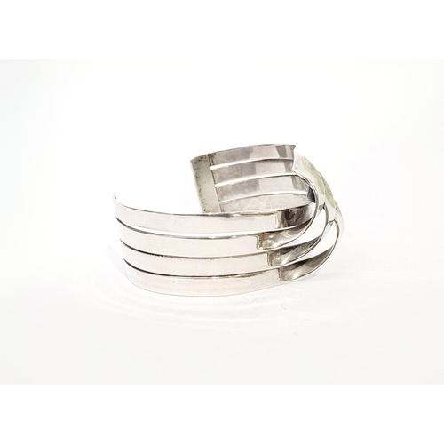 58 - A VERY FINE & WONDERFULLY CRAFTED MID-CENTURY STERLING SILVER WAVE BRACELET BANGLE, comprising of fo... 