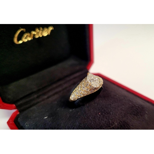 62 - A STUNNING GENUINE CARTIER PAVÉ SET DIAMOND DRESS RING, with a stunning central marquise cut diamond... 