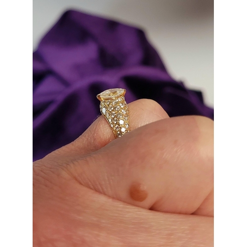 62 - A STUNNING GENUINE CARTIER PAVÉ SET DIAMOND DRESS RING, with a stunning central marquise cut diamond... 