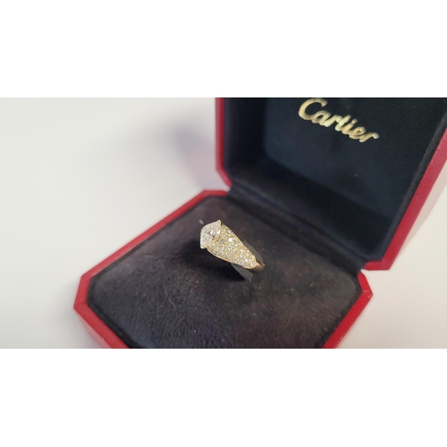 62 - A STUNNING GENUINE CARTIER PAVÉ SET DIAMOND DRESS RING, with a stunning central marquise cut diamond... 