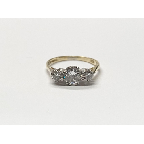 63 - A WONDERFUL 18CT YELLOW GOLD THREE STONE GRADUATED DIAMOND RING, with central large round brilliant ... 