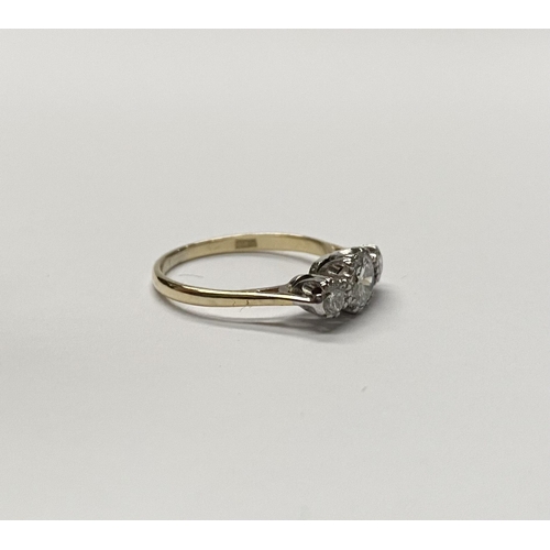 63 - A WONDERFUL 18CT YELLOW GOLD THREE STONE GRADUATED DIAMOND RING, with central large round brilliant ... 