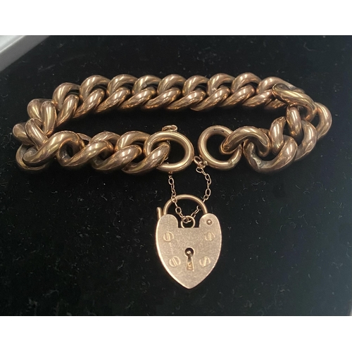 70 - A VINTAGE 9CT GOLD CHAIN LINK PENDANT BRACELET, chain link bracelet with lock heart pendant, marked ... 