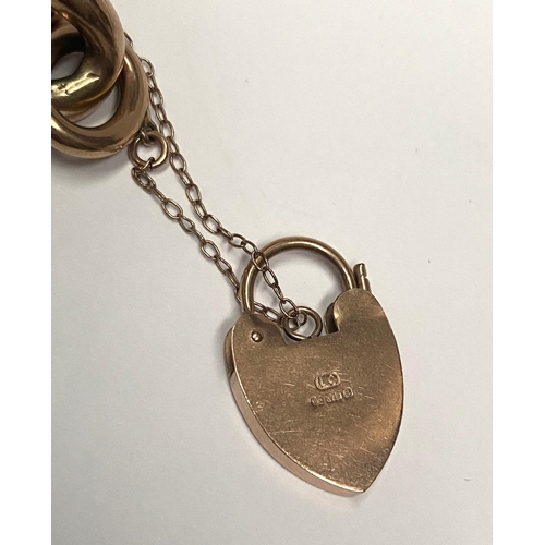 70 - A VINTAGE 9CT GOLD CHAIN LINK PENDANT BRACELET, chain link bracelet with lock heart pendant, marked ... 