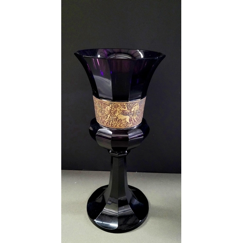 76 - AN ART DECO EARLY 20TH CENTURY MOSER KARLSBAD STYLE AMETHYST GLASS WITH OROPLASTIC GILT BAND DEPICTI... 