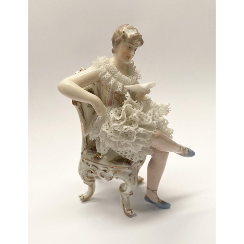 77 - A VINTAGE EUROPEAN LACE PORCELAIN FIGURINE, seated lady reading book, with lace porcelain to dress, ... 