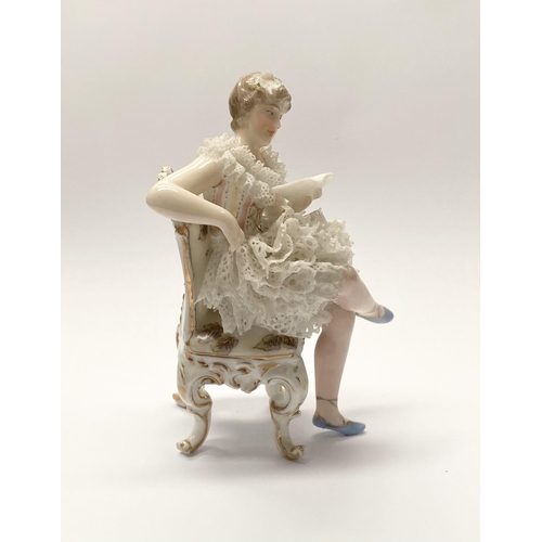 77 - A VINTAGE EUROPEAN LACE PORCELAIN FIGURINE, seated lady reading book, with lace porcelain to dress, ... 