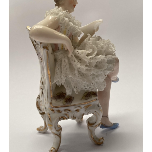 77 - A VINTAGE EUROPEAN LACE PORCELAIN FIGURINE, seated lady reading book, with lace porcelain to dress, ... 