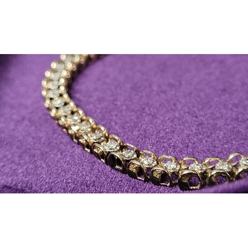 8 - A VERY ATTRACTIVE 14CT YELLOW GOLD VINTAGE DIAMOND LINK BRACELET / TENNIS BRACELET, the unique desig... 