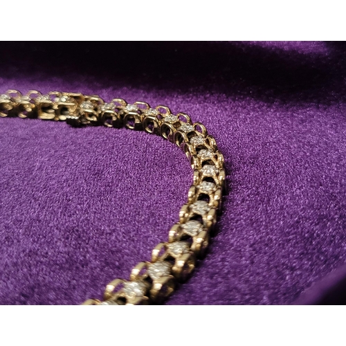 8 - A VERY ATTRACTIVE 14CT YELLOW GOLD VINTAGE DIAMOND LINK BRACELET / TENNIS BRACELET, the unique desig... 