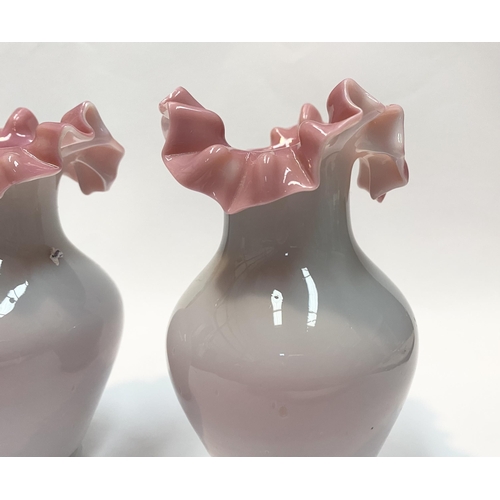 91 - A PAIR OF ANTIQUE GLASS PINK RUFFLE VASES, hand blown glass vases of baluster form with pink ruffled... 