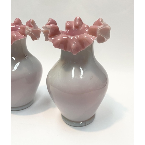 91 - A PAIR OF ANTIQUE GLASS PINK RUFFLE VASES, hand blown glass vases of baluster form with pink ruffled... 