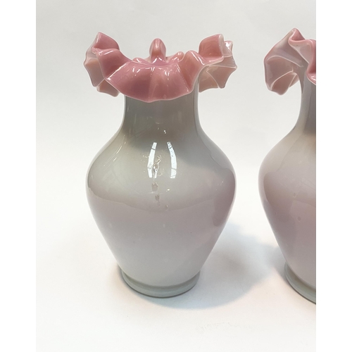 91 - A PAIR OF ANTIQUE GLASS PINK RUFFLE VASES, hand blown glass vases of baluster form with pink ruffled... 