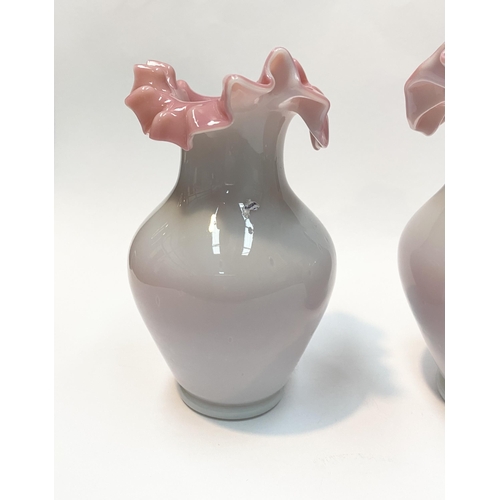 91 - A PAIR OF ANTIQUE GLASS PINK RUFFLE VASES, hand blown glass vases of baluster form with pink ruffled... 